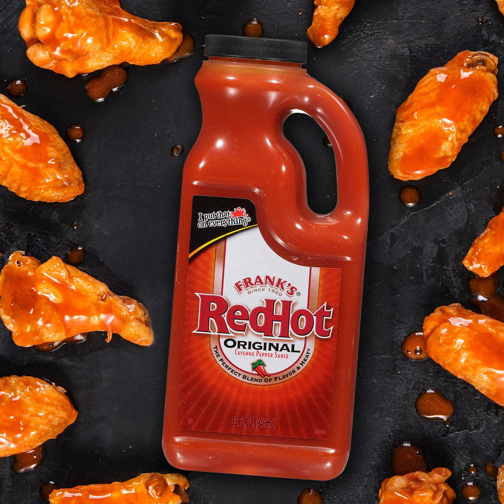 Tailgate scene with Frank's RedHot bottle and chips
