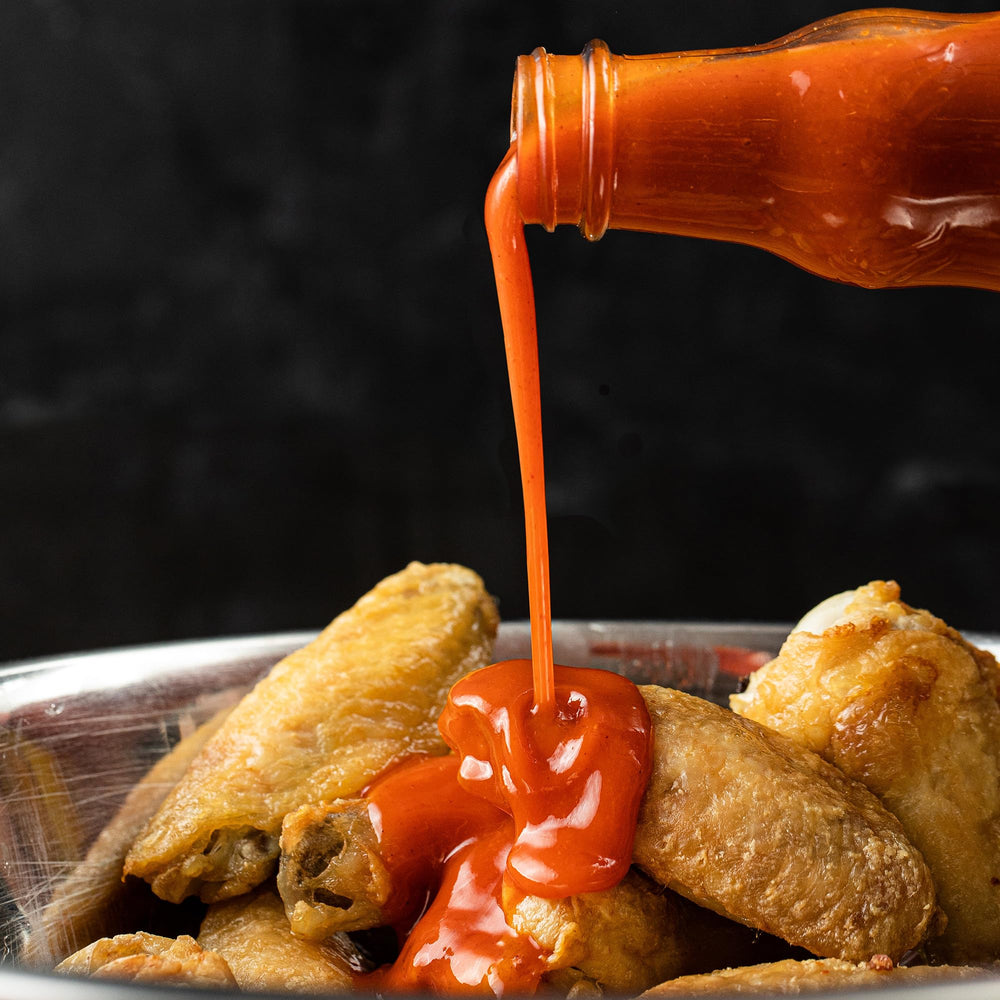 Franks RedHot Original at a tailgate with party vibes