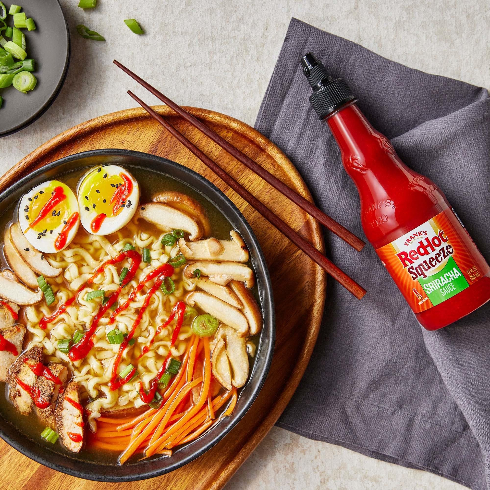 Eggs enhanced with Frank's RedHot Squeeze Sriracha drizzle