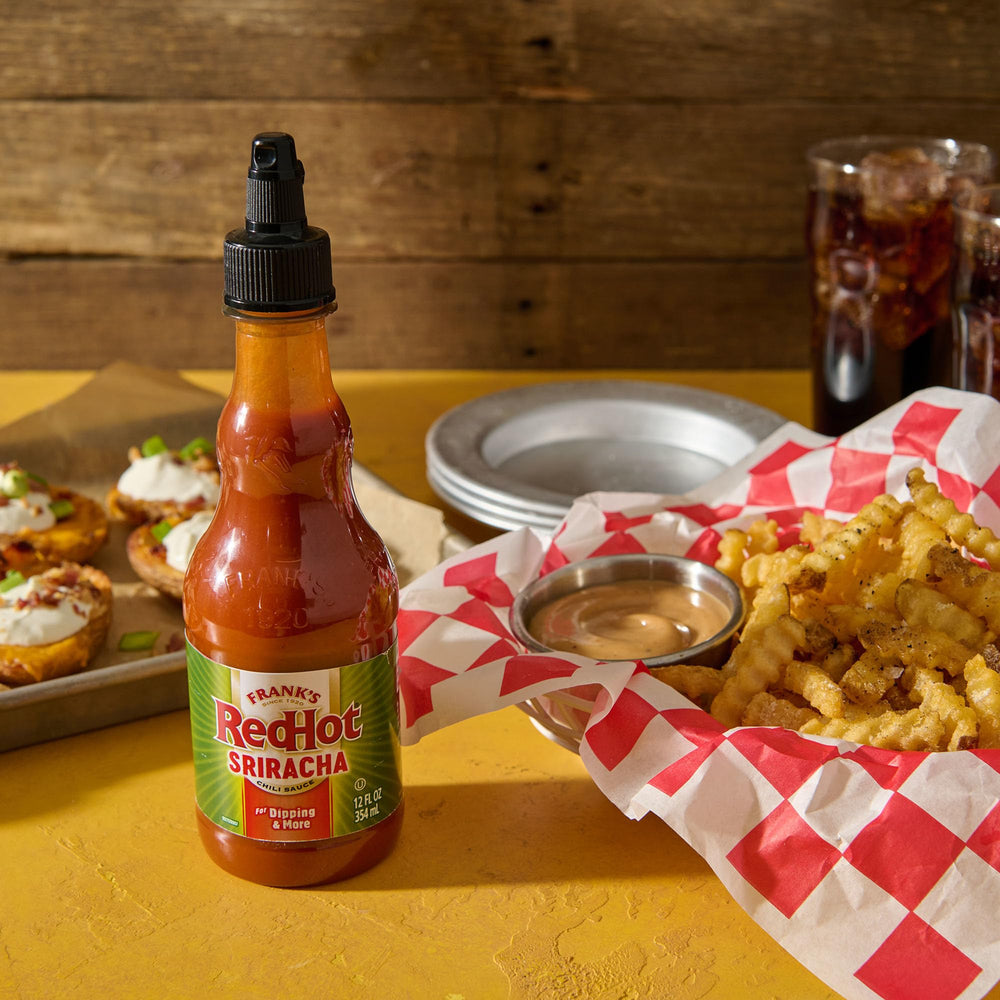 12-ounce squeeze bottle of Frank's RedHot Sriracha ready for table use