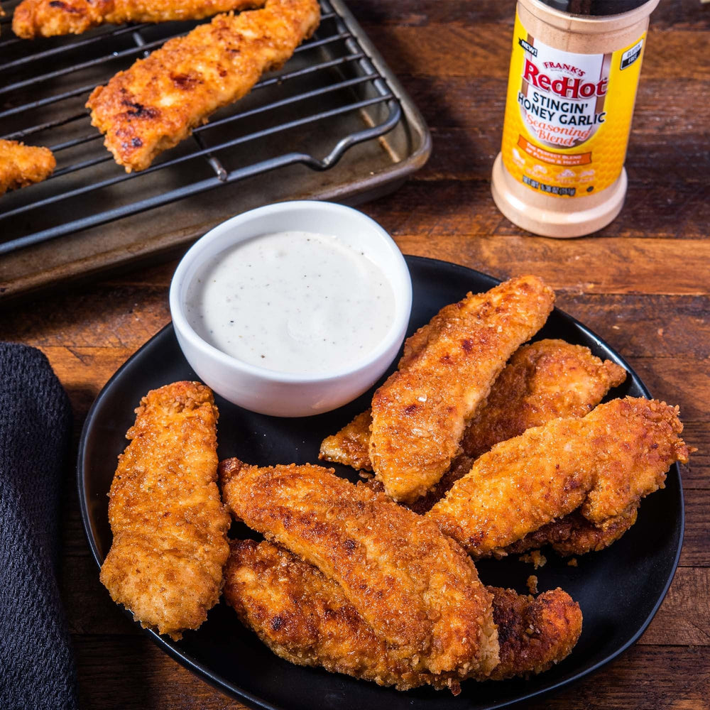 Fries sprinkled with Frank's RedHot Stingin' Honey Garlic Seasoning Blend for a subtle heat.