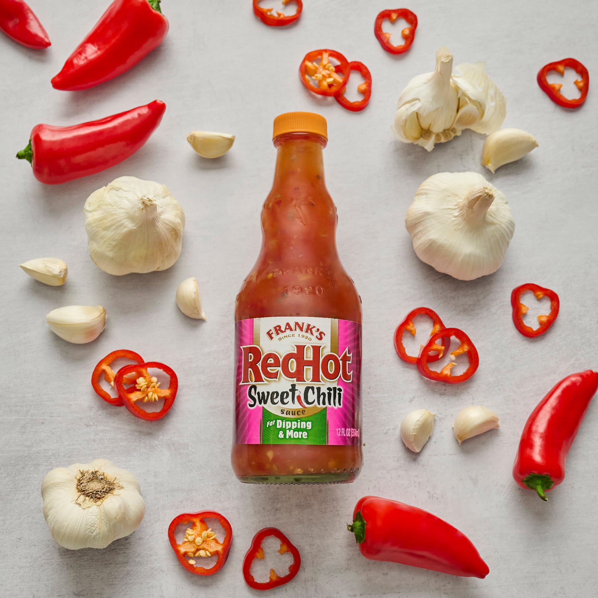 Frank's RedHot Sweet Chili Sauce bottle on display with packaging