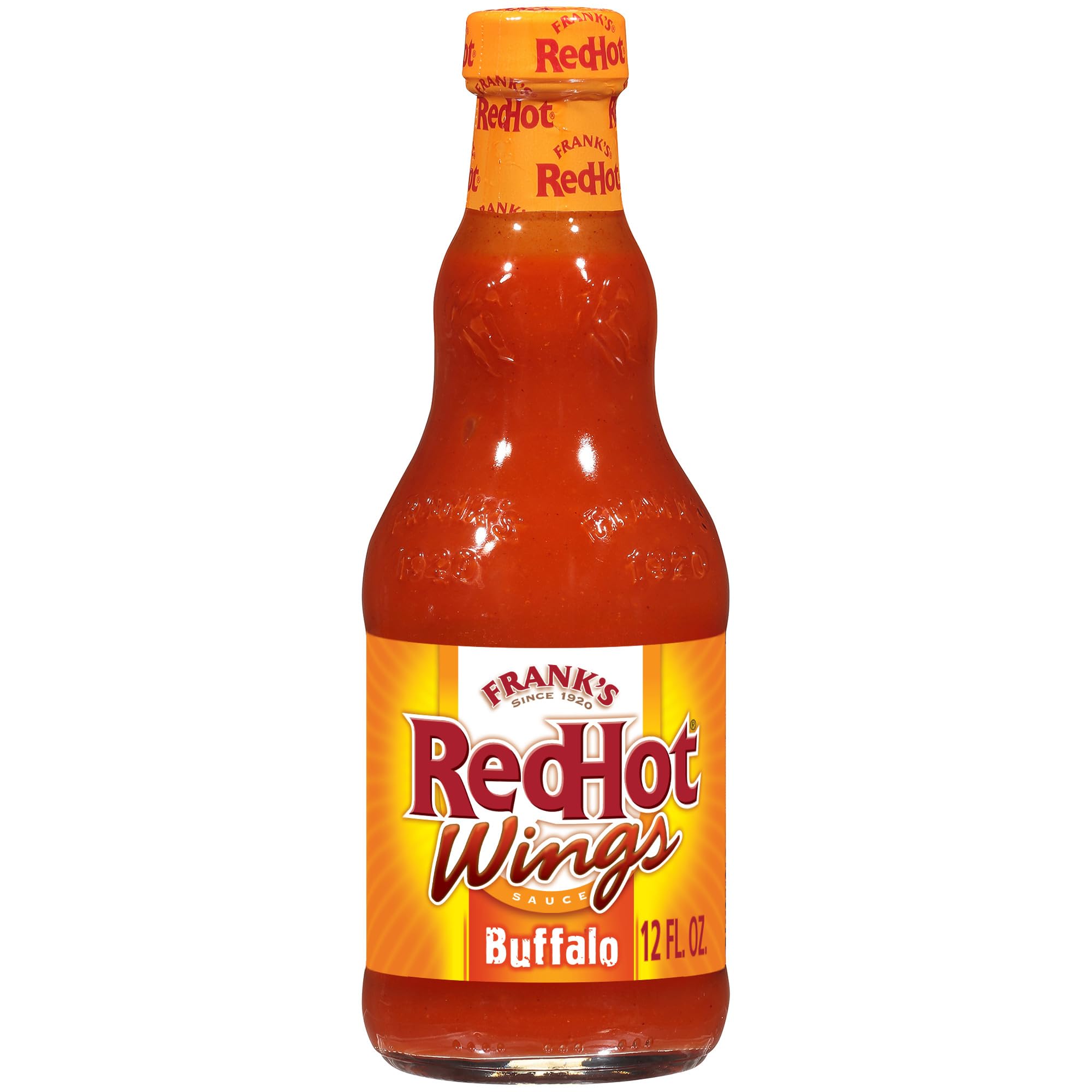 Frank's RedHot Buffalo Wings Sauce bottle pouring on wings for bold heat.