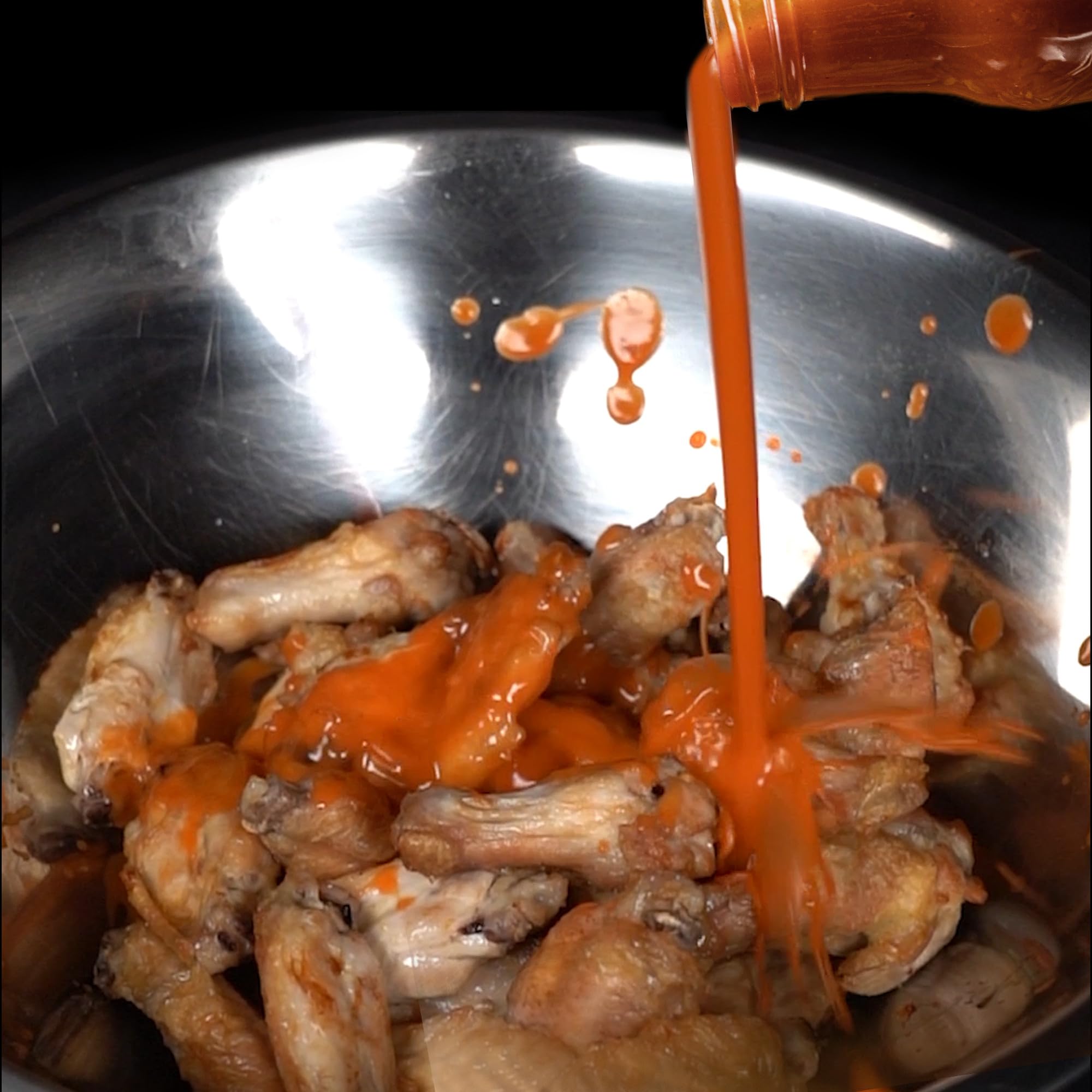Tailgate setup showcasing Frank's RedHot Buffalo Wings Sauce for game day flavor.