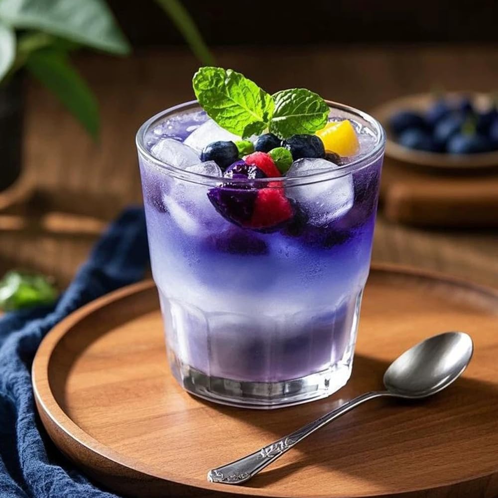Fraunitsh color-changing cocktail with citrus and butterfly pea powder