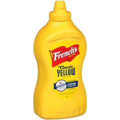 French's Classic Yellow Mustard bottle on table, ready to top sandwiches.