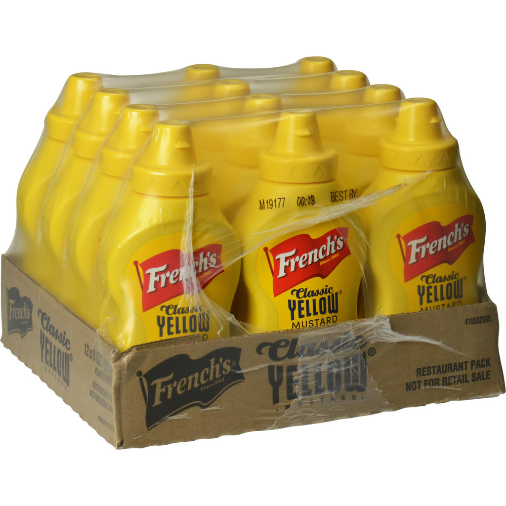 French's Classic Yellow Mustard squeeze bottle pouring on a hot dog for bold flavor