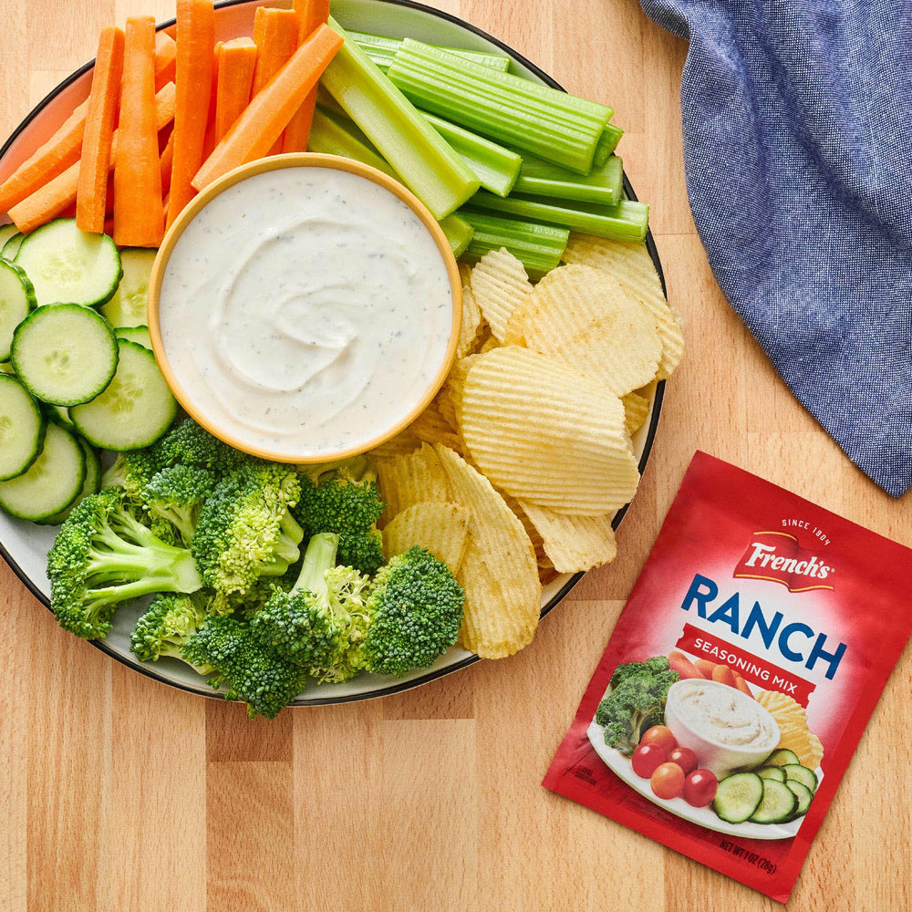 Dispense spoon with French's Ranch Seasoning demonstrates measured seasoning.