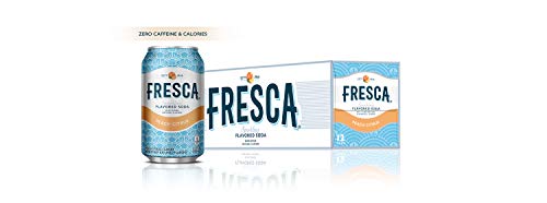 Fresca Peach Soda bottle beside a glass, showcasing refreshing peach flavor.