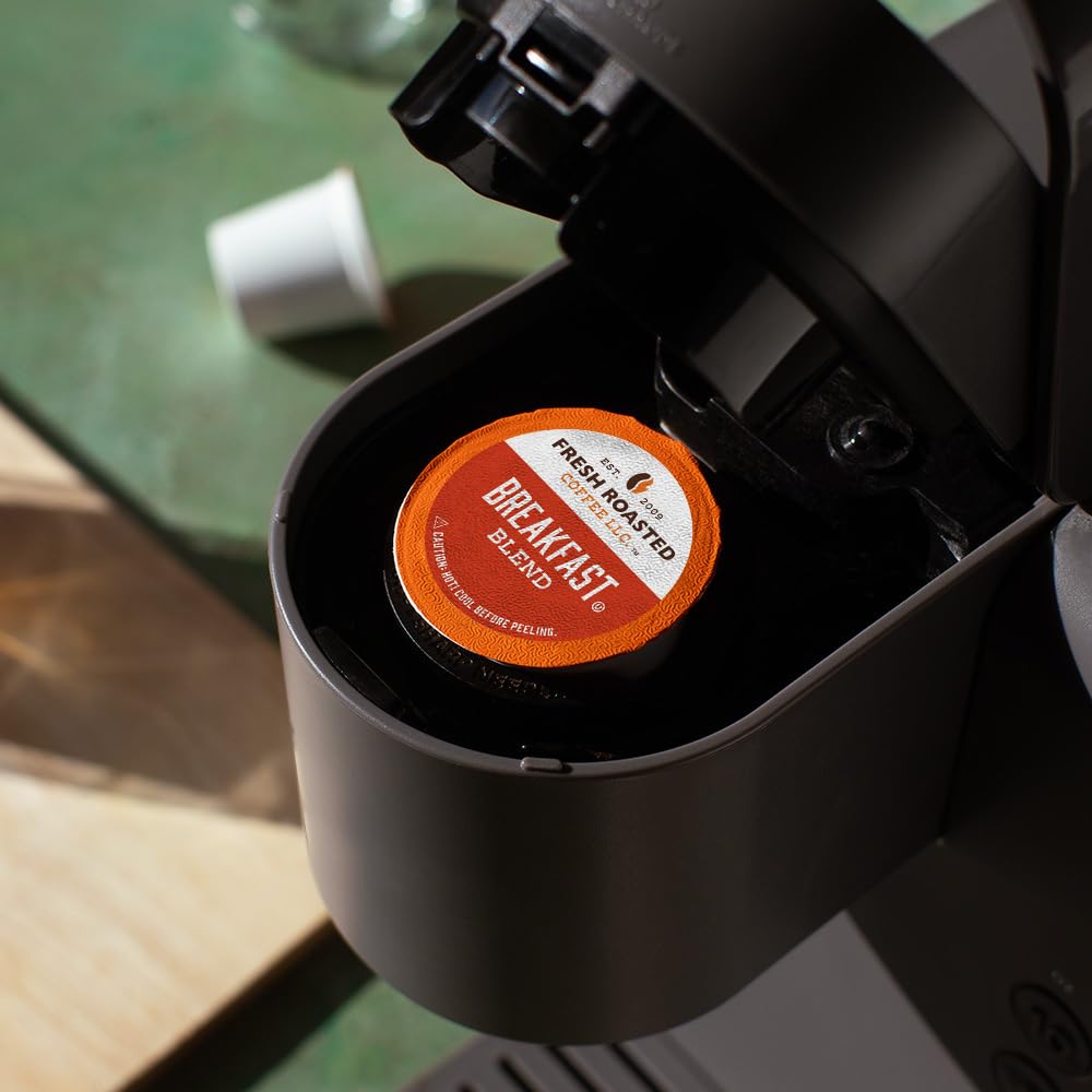 Fresh Roasted Coffee Breakfast Blend pod in cup showcasing aroma for breakfast.