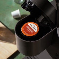 Fresh Roasted Coffee Breakfast Blend pod in cup showcasing aroma for breakfast.