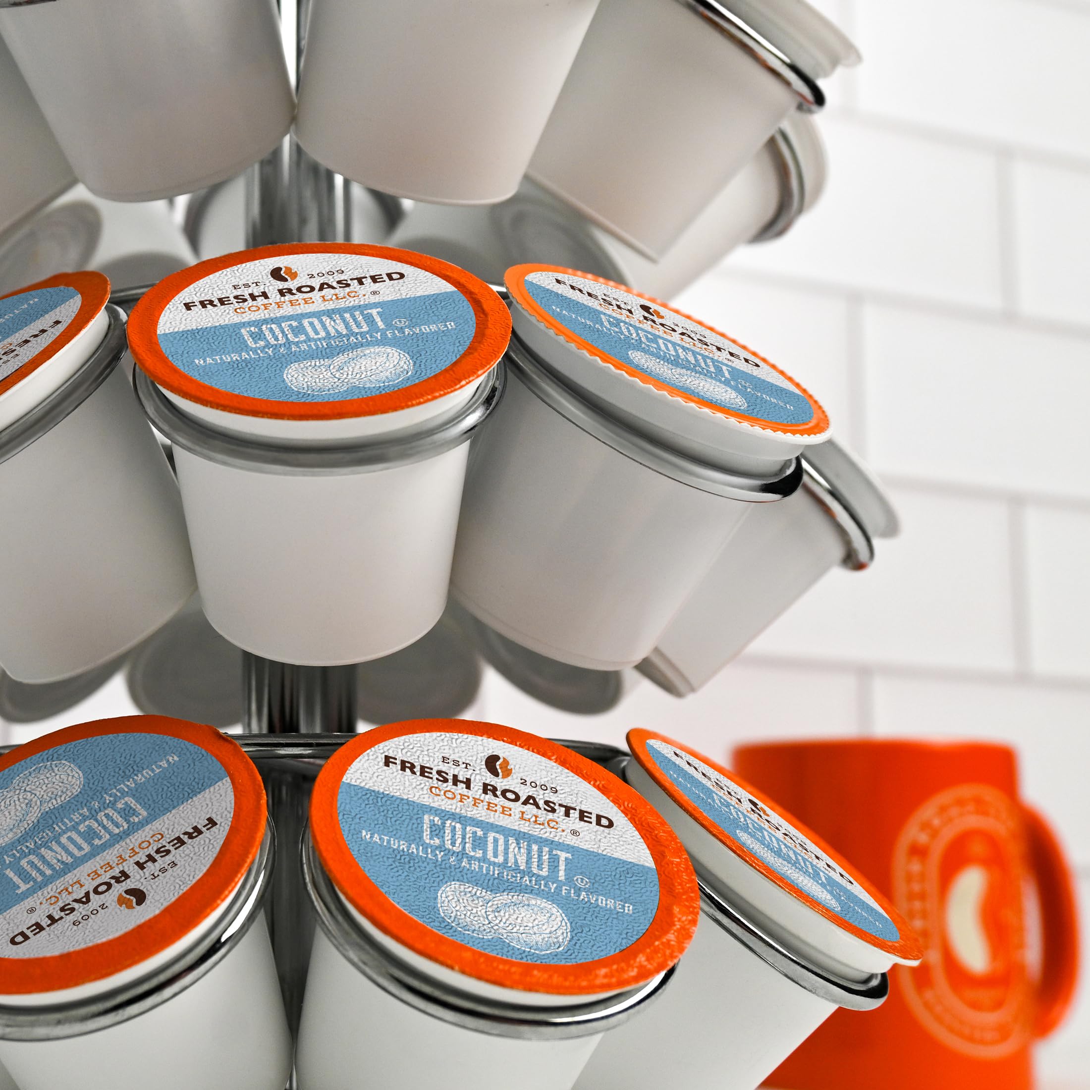 Label detail shows 100% Arabica and recyclable packaging.