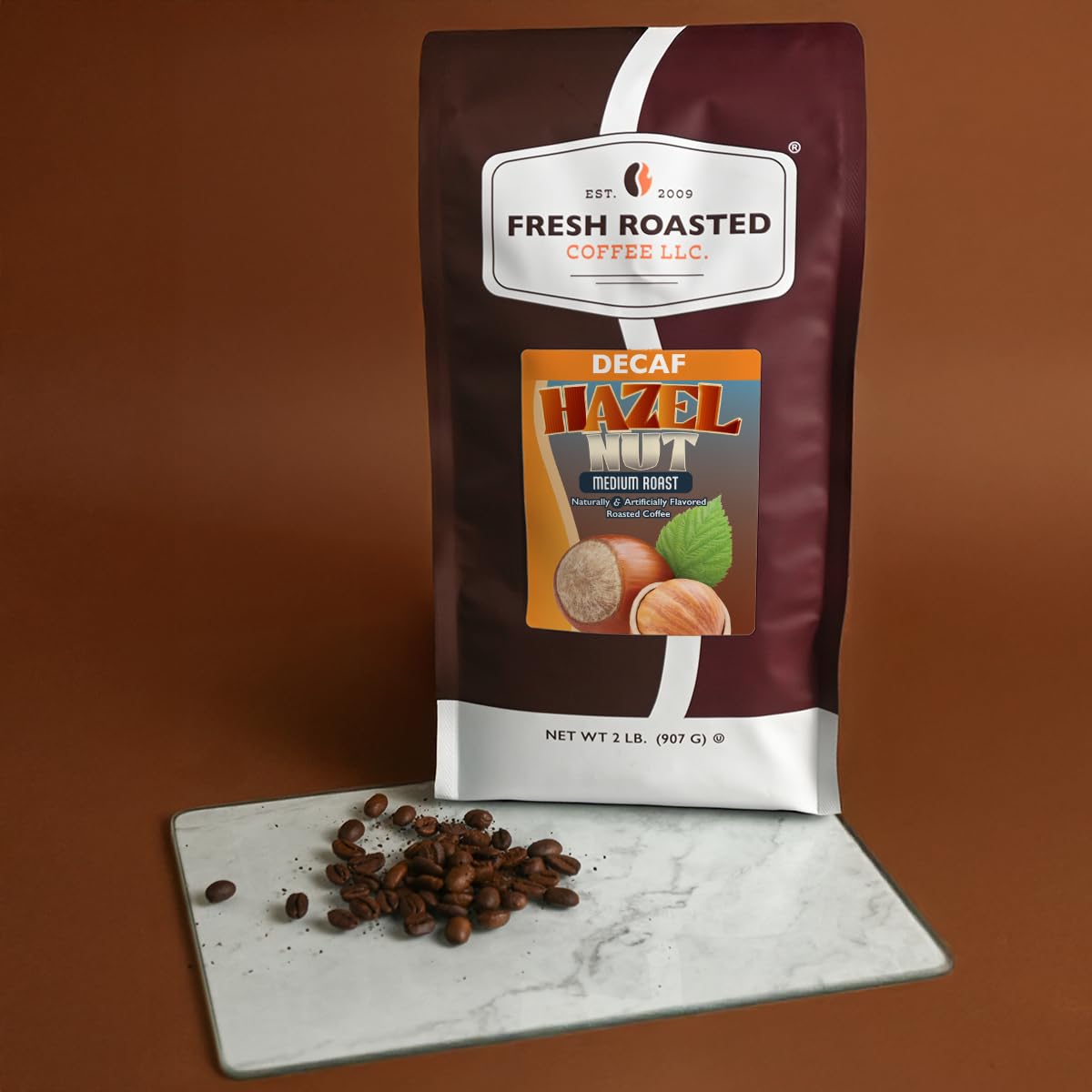 Fresh Roasted Coffee decaf hazelnut pours smoothly for a delightful cup.