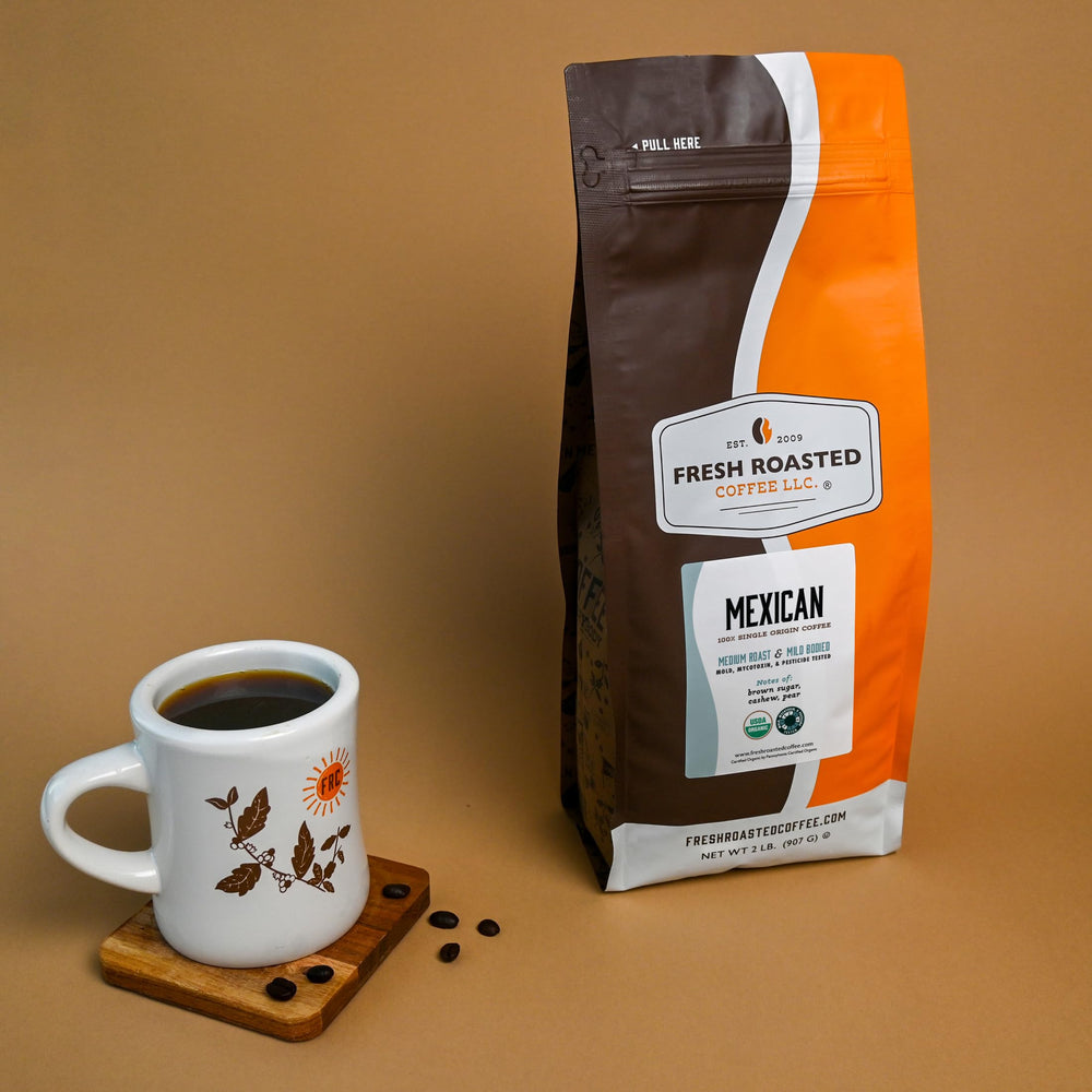 Fresh Roasted Coffee Mexican Ground being poured into cup for aroma