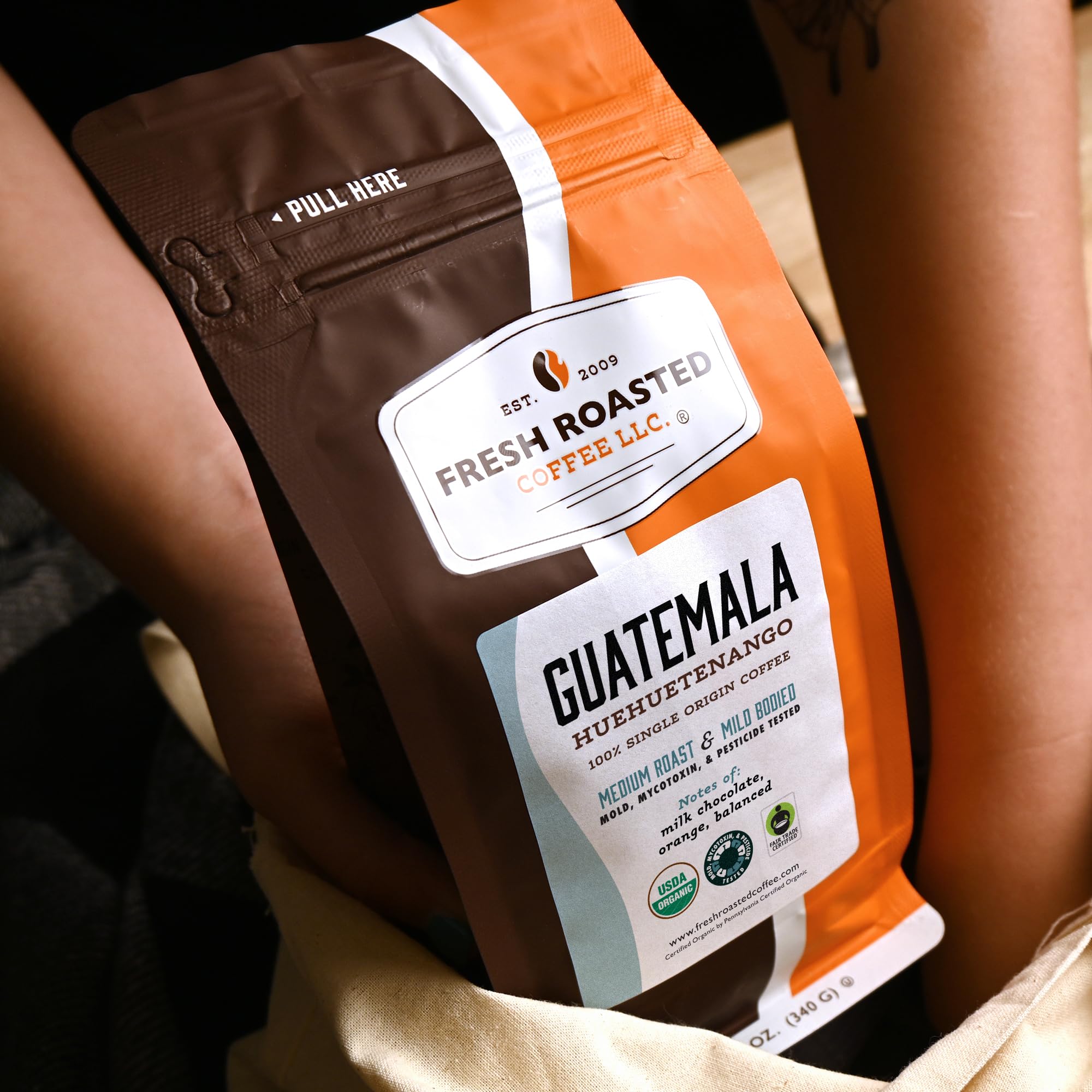 Fresh Roasted Coffee Organic Guatemala packaging close-up with USDA Organic and Fair Trade seals.