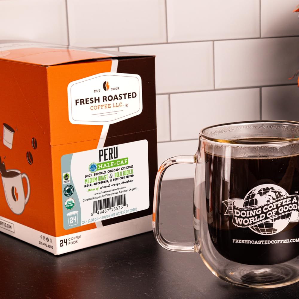 Fresh Roasted Coffee Peru Half Caf tasting cup reveals almond, chocolate, and orange notes.