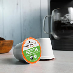Fresh Roasted Coffee Peru Half Caf whole beans close-up highlighting rich color and premium quality.