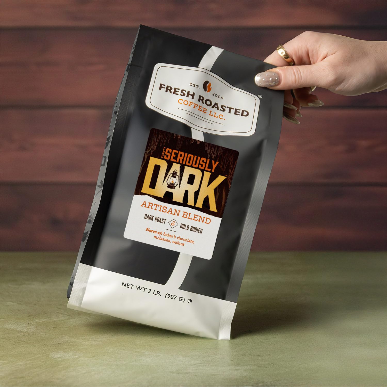 Fresh Roasted Coffee Seriously Dark Artisan beans ready for grind signaling a robust profile.