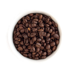 Fresh Roasted Coffee Tanzanian Peaberry whole beans close-up showing vibrant color and aroma