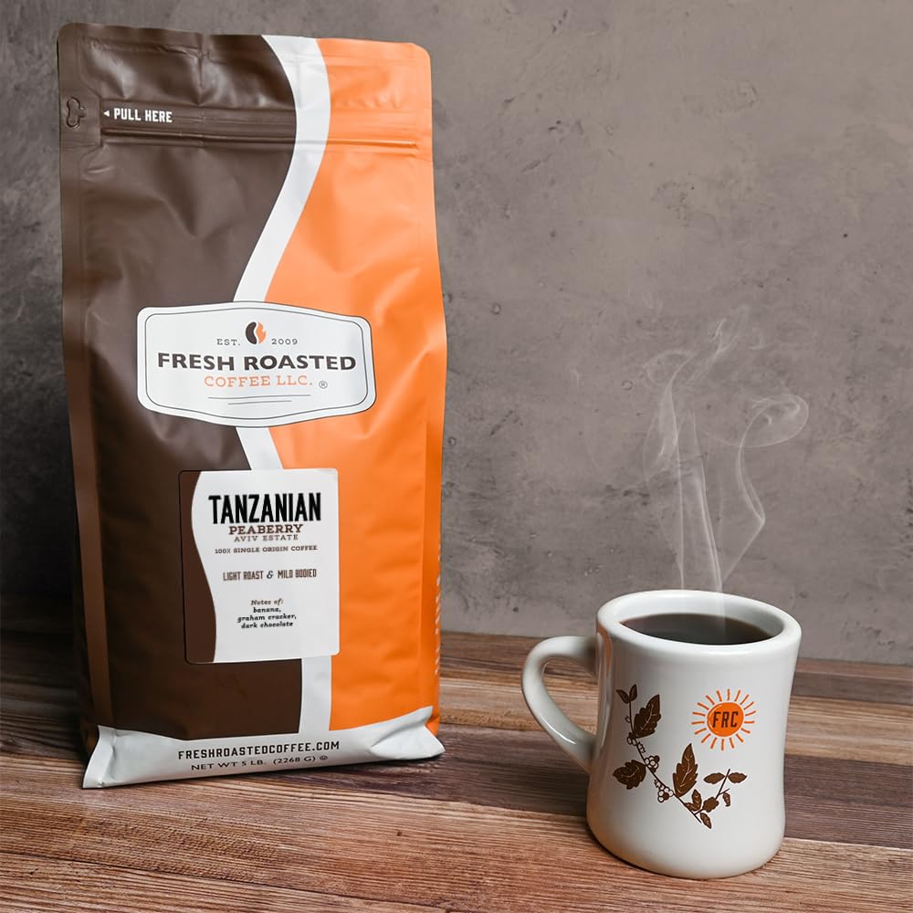 Fresh Roasted Coffee Tanzanian Peaberry scoop visual, ready to brew.