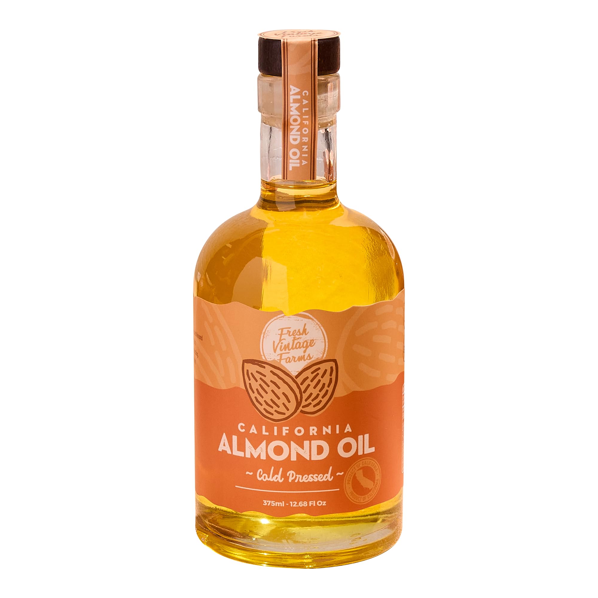 Fresh Vintage Farms almond oil bottle pouring for cooking and dressings.