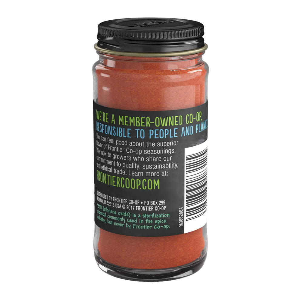 Frontier Co-op Cayenne Powder jar closeup emphasizes natural, non-irradiated spice for flavorful meals.
