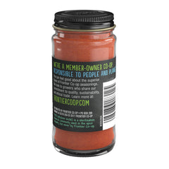 Frontier Co-op Cayenne Powder jar closeup emphasizes natural, non-irradiated spice for flavorful meals.