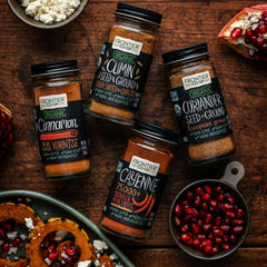 Frontier Co-op Cayenne spice dust on spoon showcases vibrant color and peppery aroma.