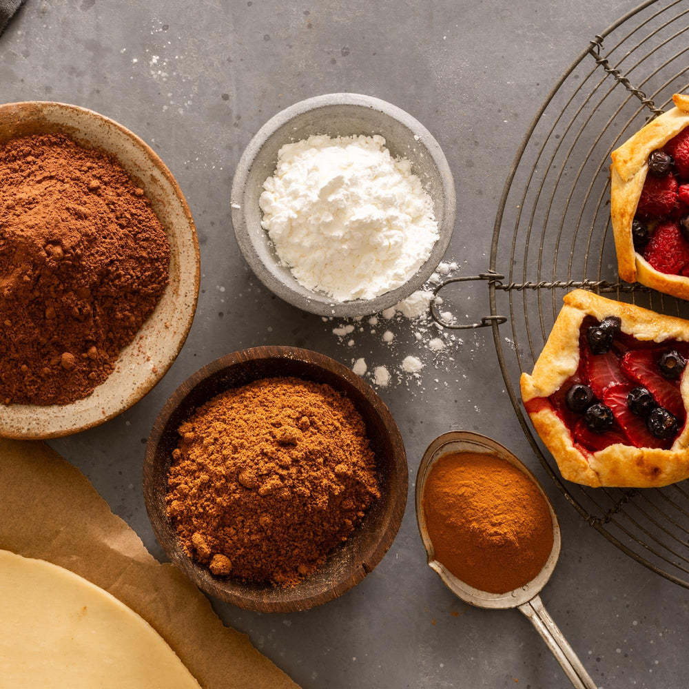 Frontier Co-op corn starch powder is measured into a spoon for sauces.