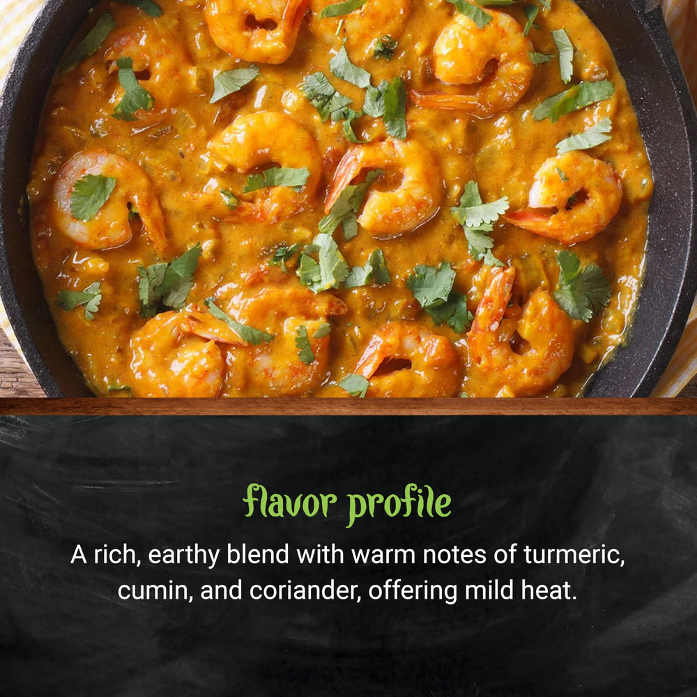 Frontier Co-op Organic Curry Powder poured over a wooden spoon in a kitchen scene.