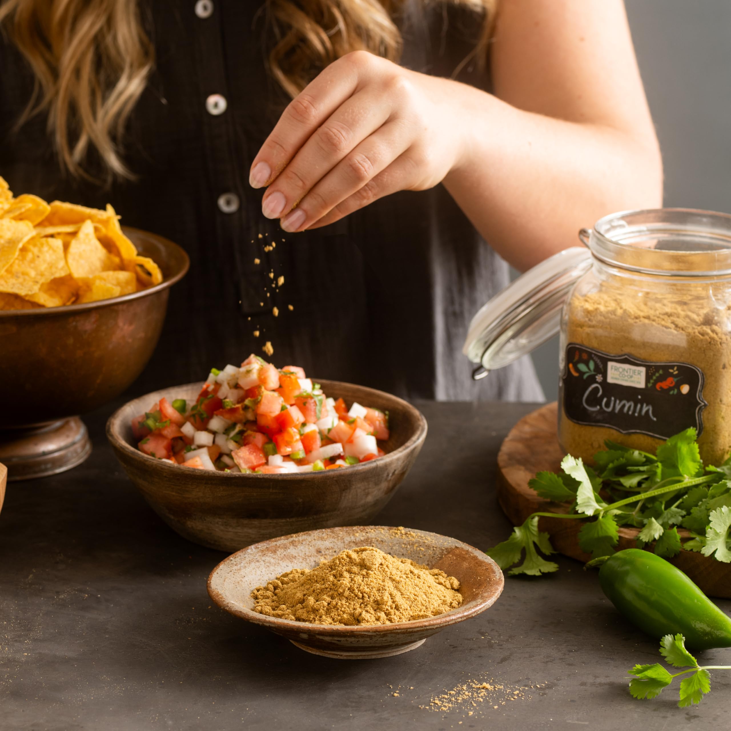 Frontier Co-op ground cumin on spice rack ready to boost meals.