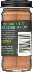 Frontier Co-op Ground Korintje Cinnamon jar and spoon ready for measuring and cooking.