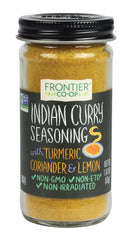 Frontier Co-op Indian Curry Seasoning bottle on kitchen counter, ready to flavor weeknight meals.