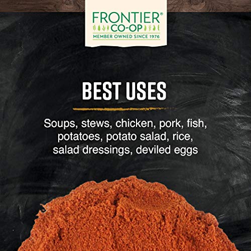 Kitchen scene featuring Frontier Co-op paprika in a spice rack setup.