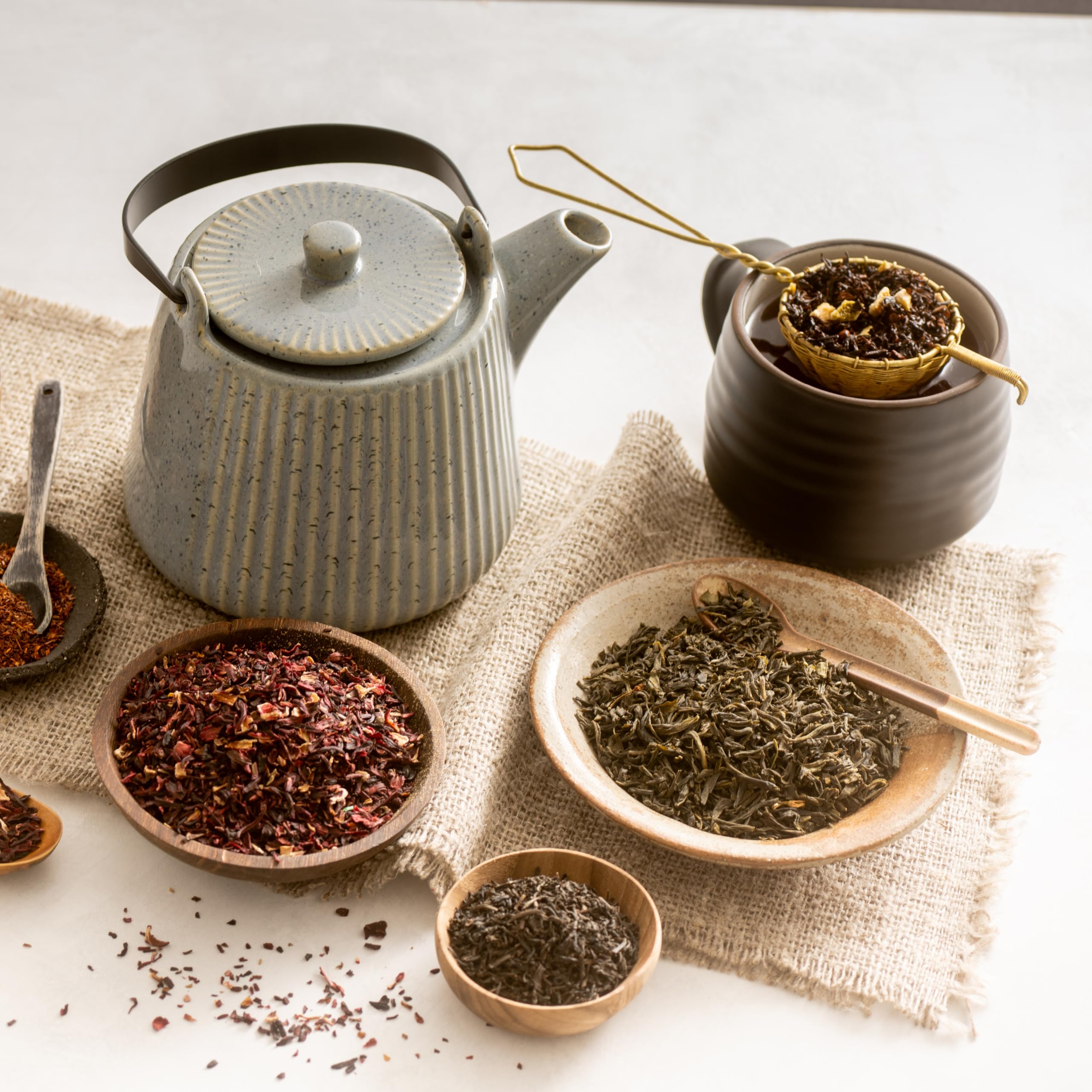 Frontier Co-op Jasmine Green Tea packaging shows organic and Fair Trade seals for ethical sourcing.