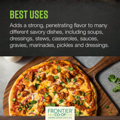 Garlic powder poured over a dish to boost flavor