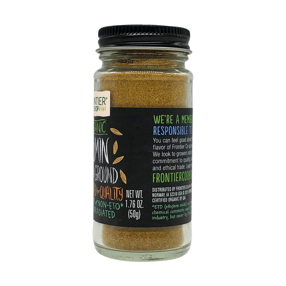 Frontier Co-op organic ground cumin sprinkled over hummus and vegetables.