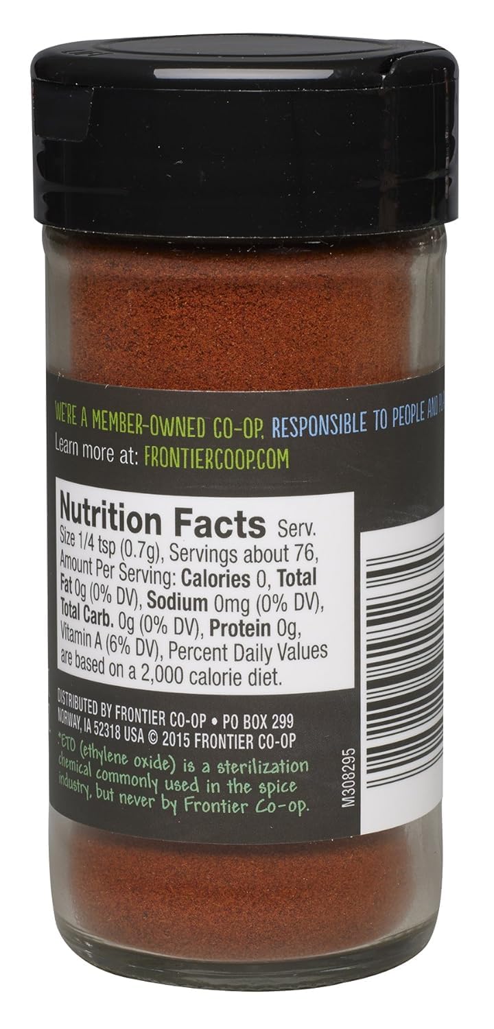 Frontier Co-op smoked paprika sprinkled in a pan, capturing color and aroma.