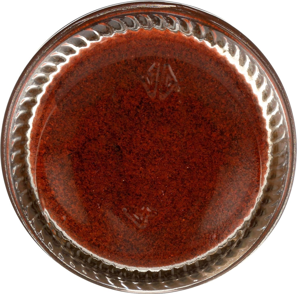 Frontier Co-op smoked paprika on roasted nuts, offering a spicy-smoky finish.