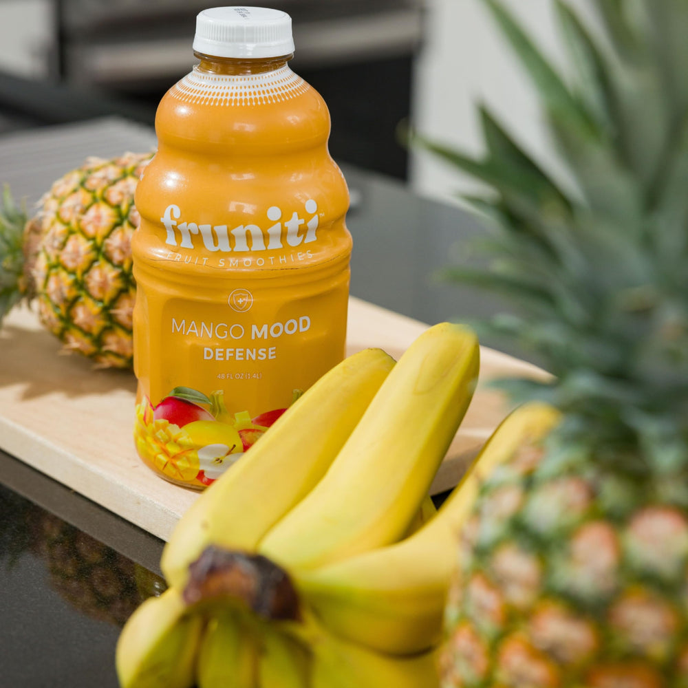Served Fruniti Mango Smoothie Mix ready-to-drink cup.