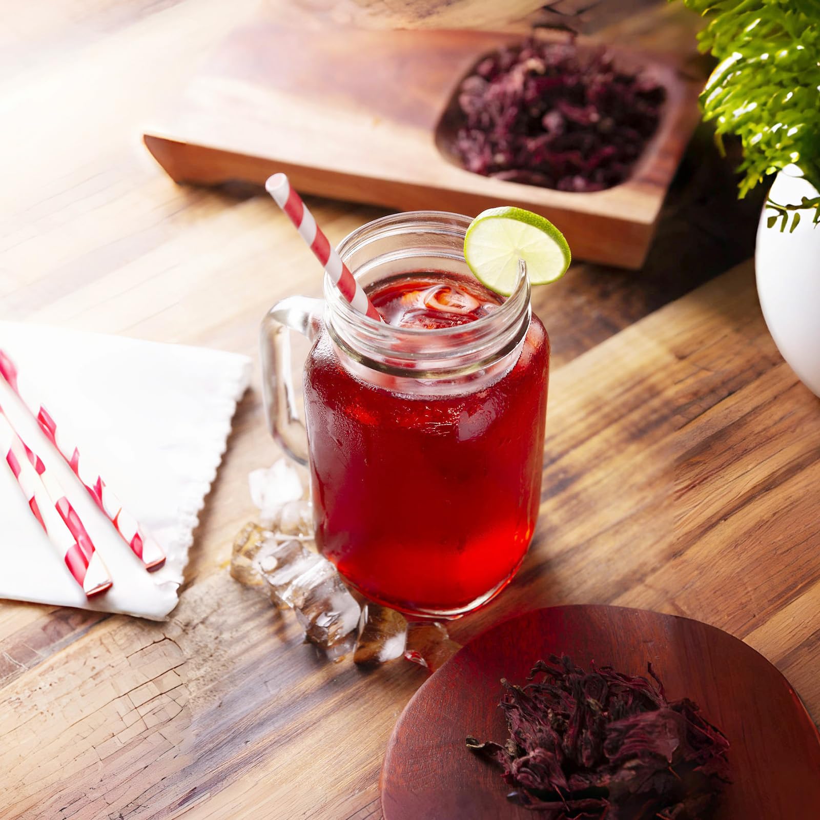 FullChea measuring spoon beside hibiscus for precise brew.