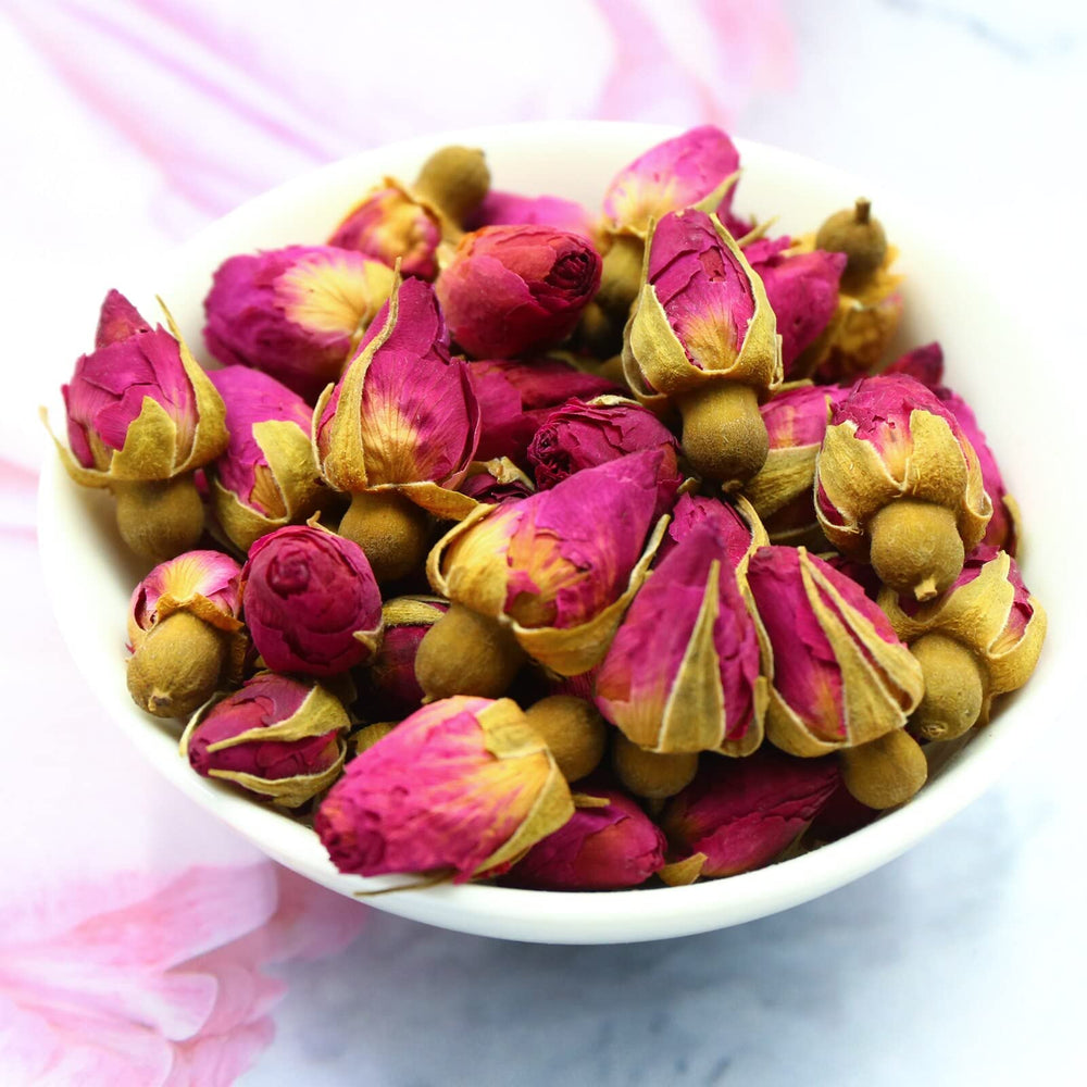 FullChea rose buds tea in cup, aromatic and edible.