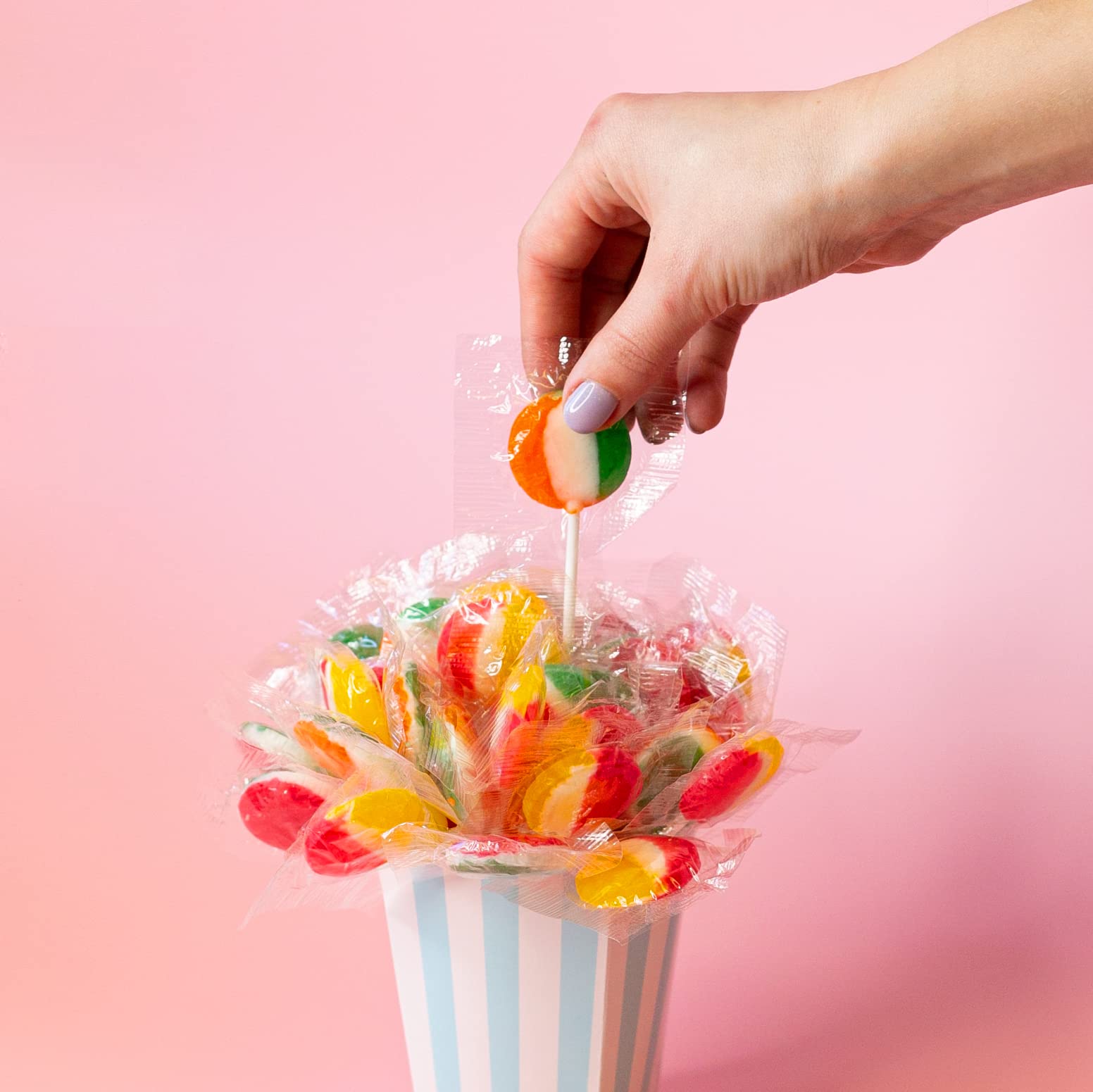 Flat-shaped FUNTASTY fruit lollipops shown for easy stacking.