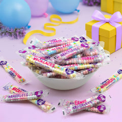 Bright mixed fruit flavors featured on colorful wearable candy jewelry for kids.