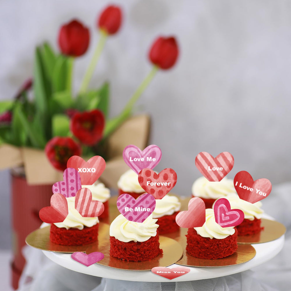 Fyeoxle heart toppers on a cupcake add festive flair.