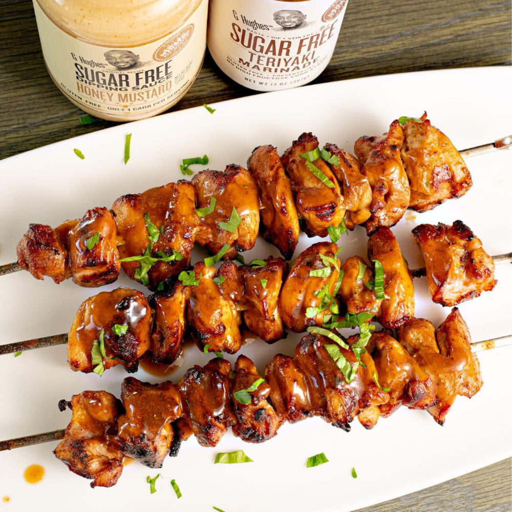 G Hughes Teriyaki sugar free marinade glazing a sizzling steak