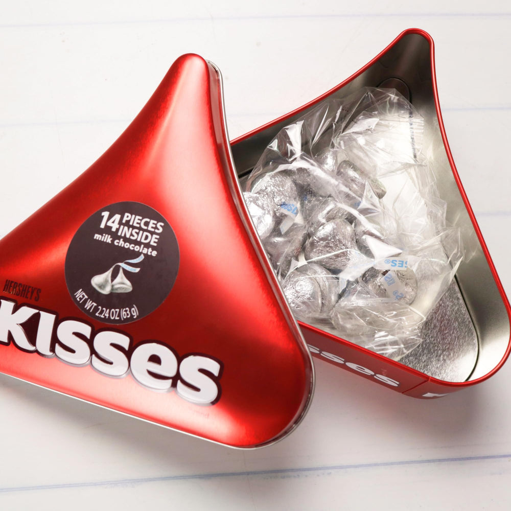 Galerie Hershey Kisses bring iconic flavor in smooth milk chocolate inside the tin.