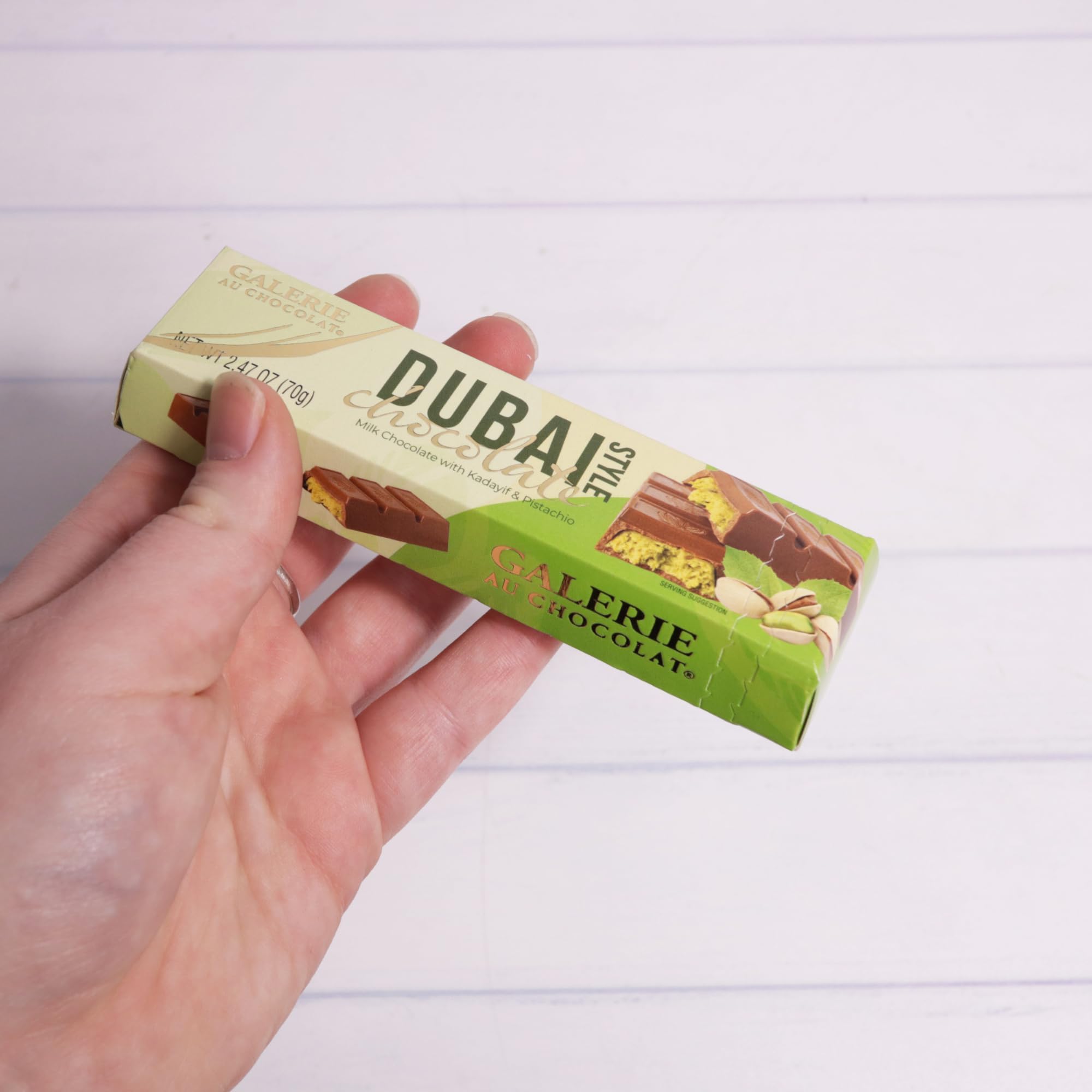 Galerie Dubai chocolate bar close-up showing glossy milk chocolate and textured filling.
