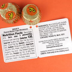 Seven individually wrapped Reese’s cups visible inside the basketball pouch