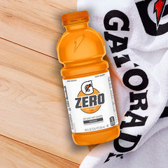 Pouring G Zero Orange to illustrate electrolyte replenishment during training